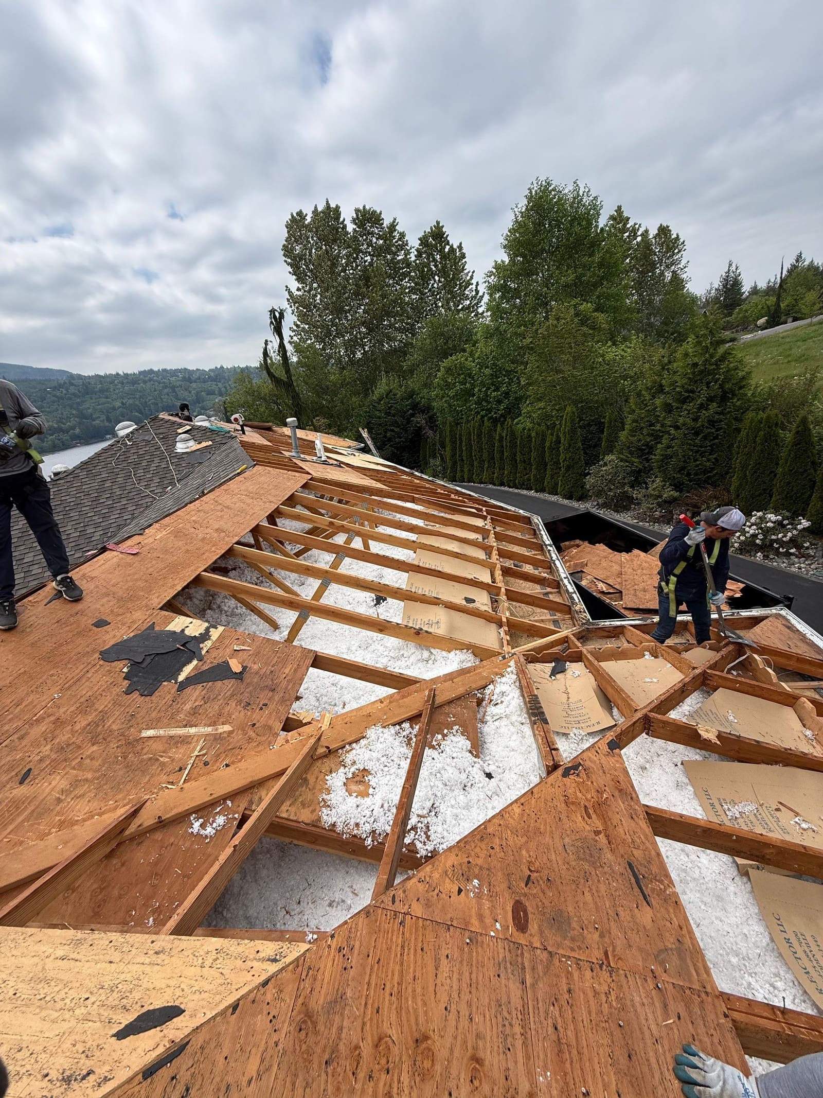 JBA crew removing damaged roof decking during repair